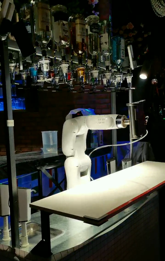 Robotic arm mixes cocktails